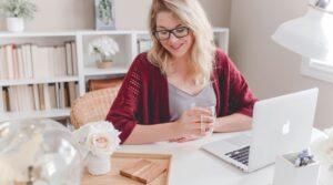 Woman working with laptop in a home office